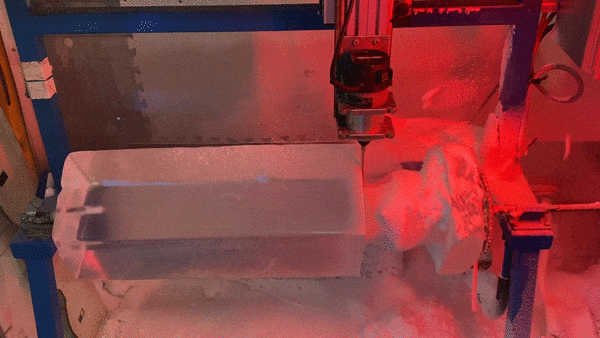 A block of ice being shaved down.